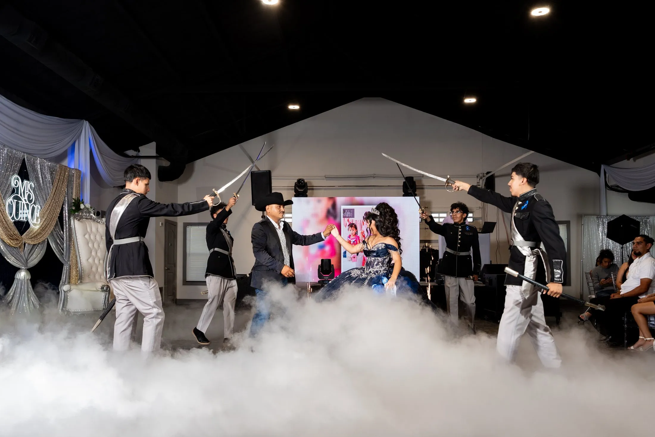 Chambelanes performing a sword routine in the fog during the surprise dance