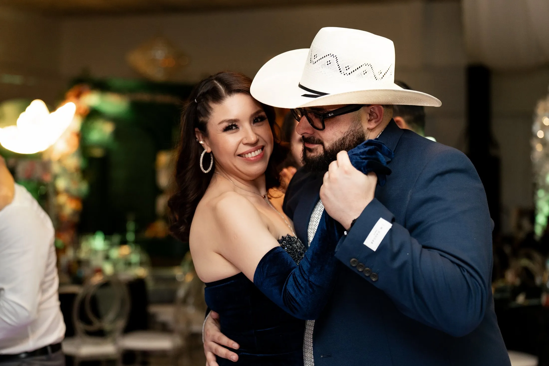 Couple in a cowboy hat dancing together