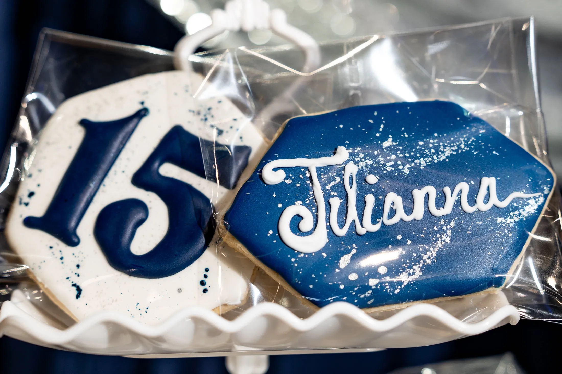 Hand-decorated “15” and name sugar cookies for the quinceañera favors