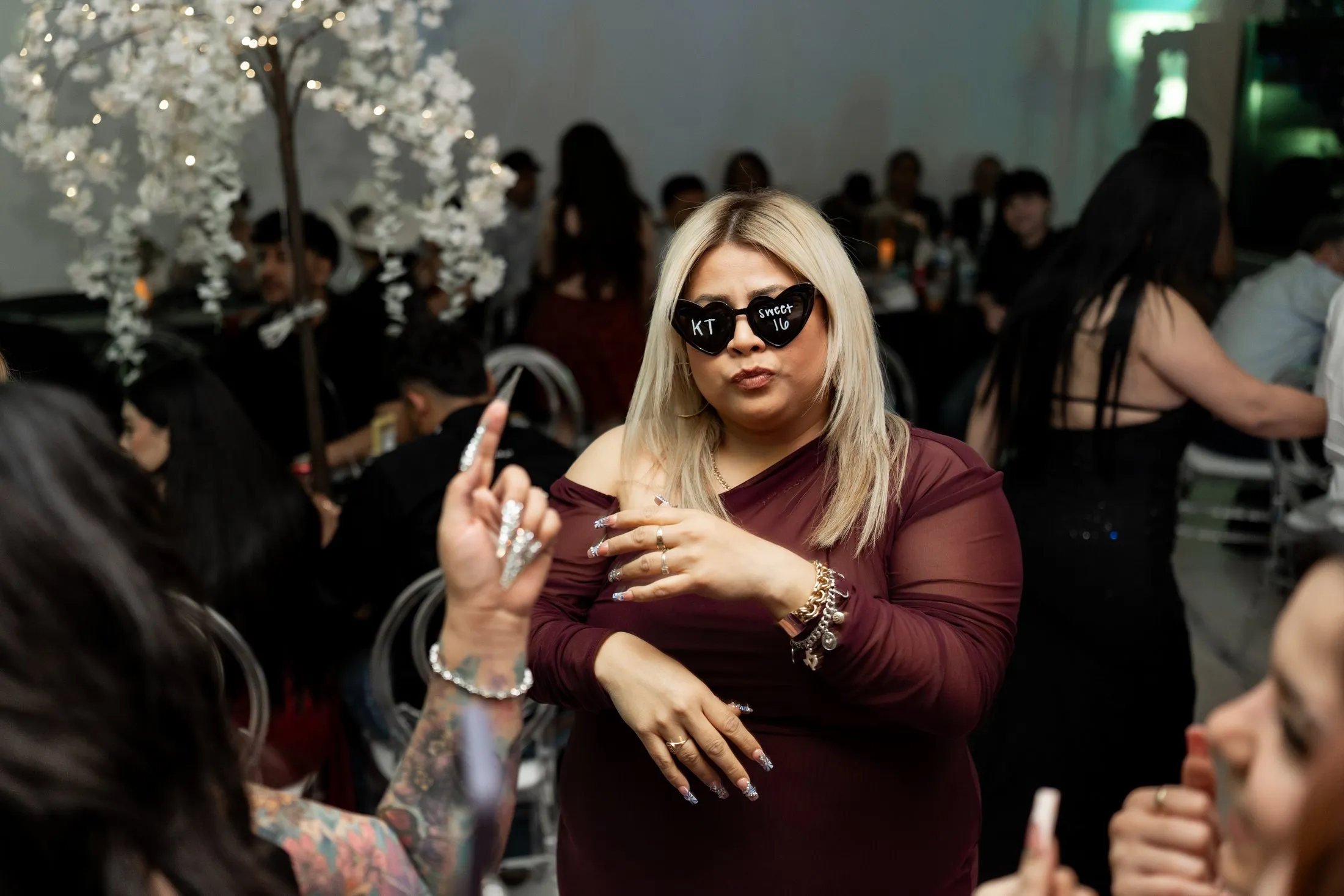 Guest in heart sunglasses dancing