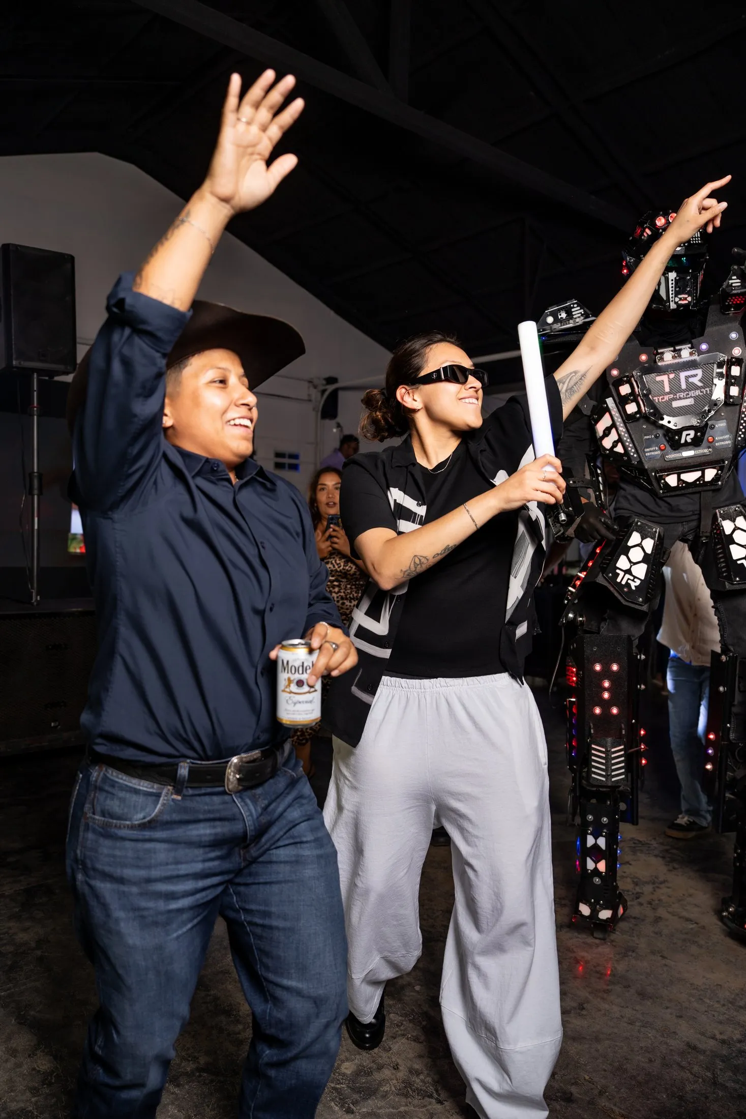 Guests dancing next to the LED robot during the hora loca