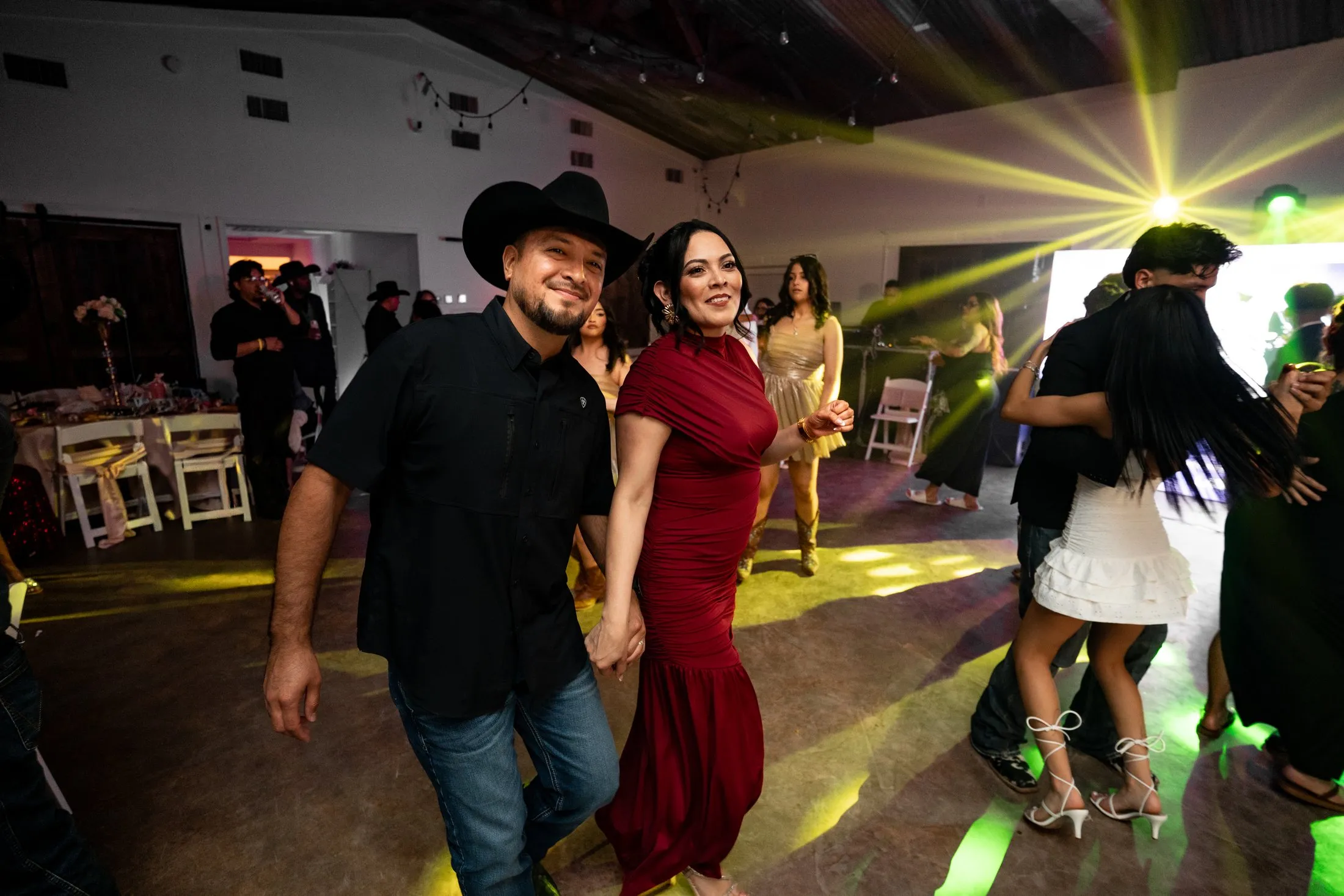 Guests dancing under the party lights at Hidden Acres Ranch in Hudson Oaks
