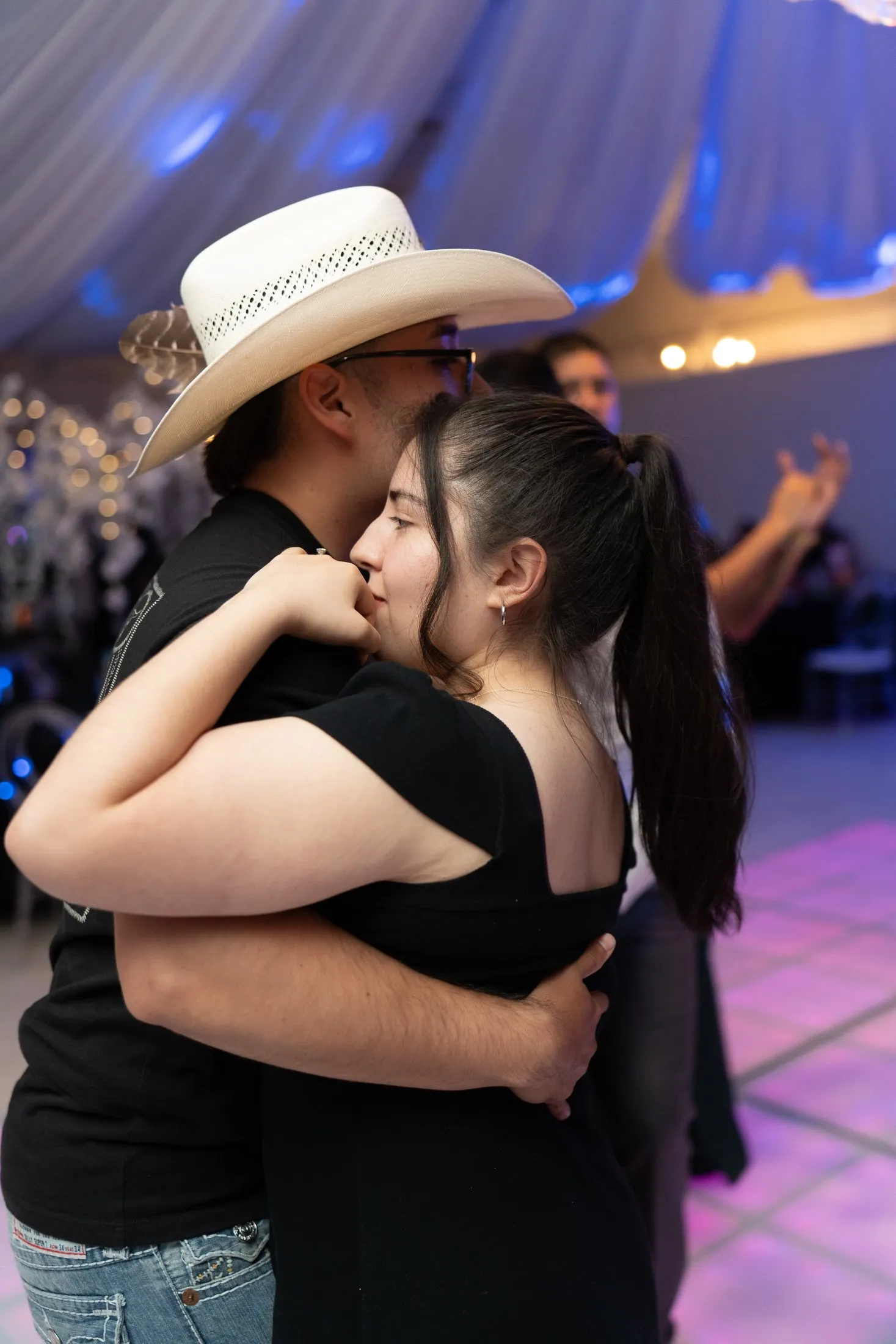Guests slow dancing at the reception