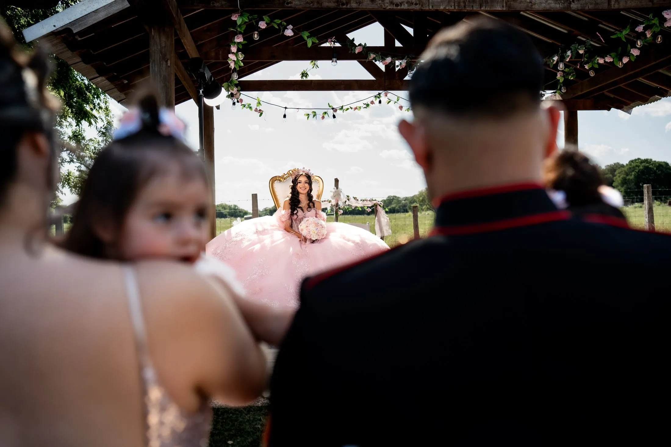 Guests watching the quinceañera from the front row of the blessing at Hidden Acres Ranch in Hudson Oaks