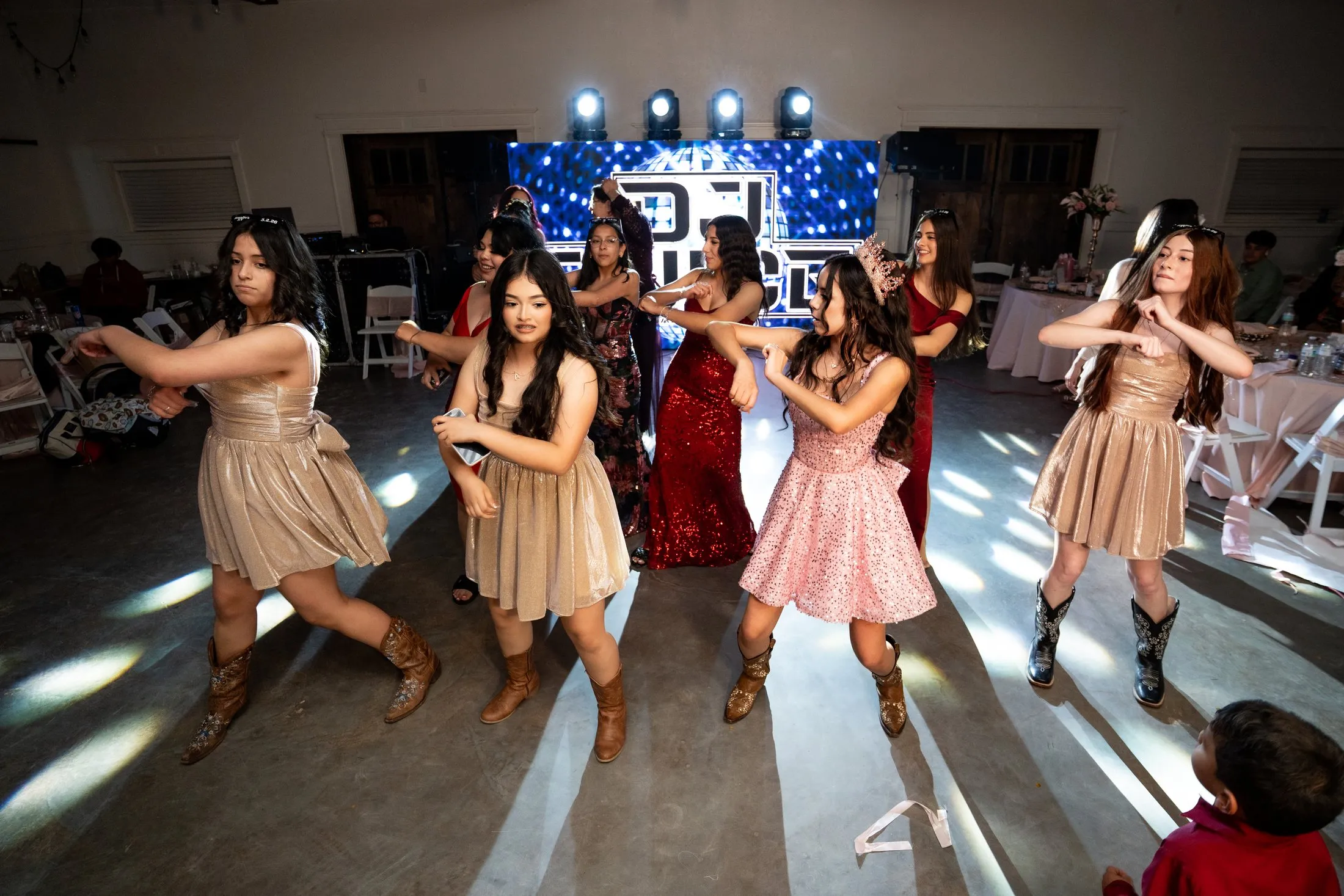 Line dancing with the damas at the quince party at Hidden Acres Ranch in Hudson Oaks