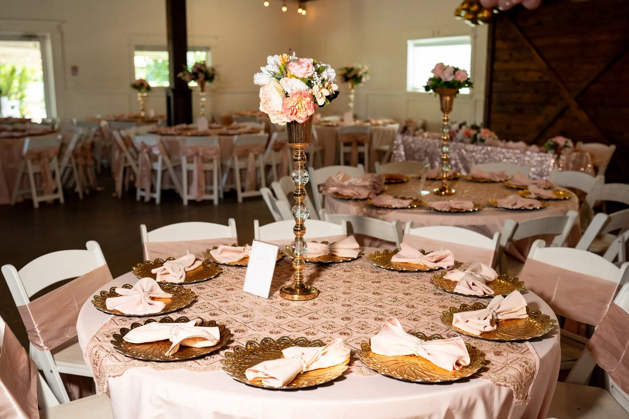 Pink and gold reception tables at Hidden Acres Ranch in Hudson Oaks, Texas