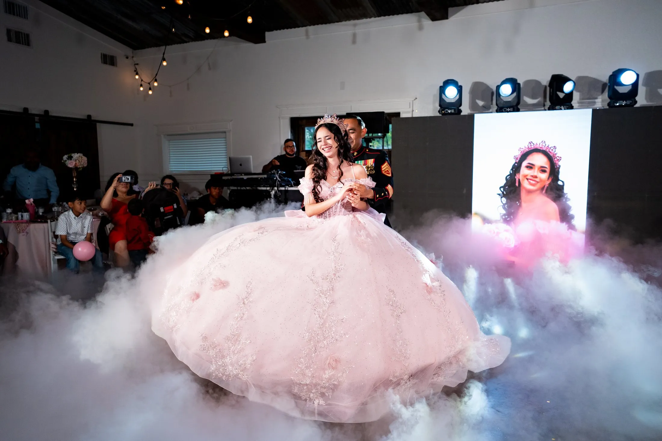 Quinceañera dancing through dry-ice fog in her pink gown at Hidden Acres Ranch in Hudson Oaks
