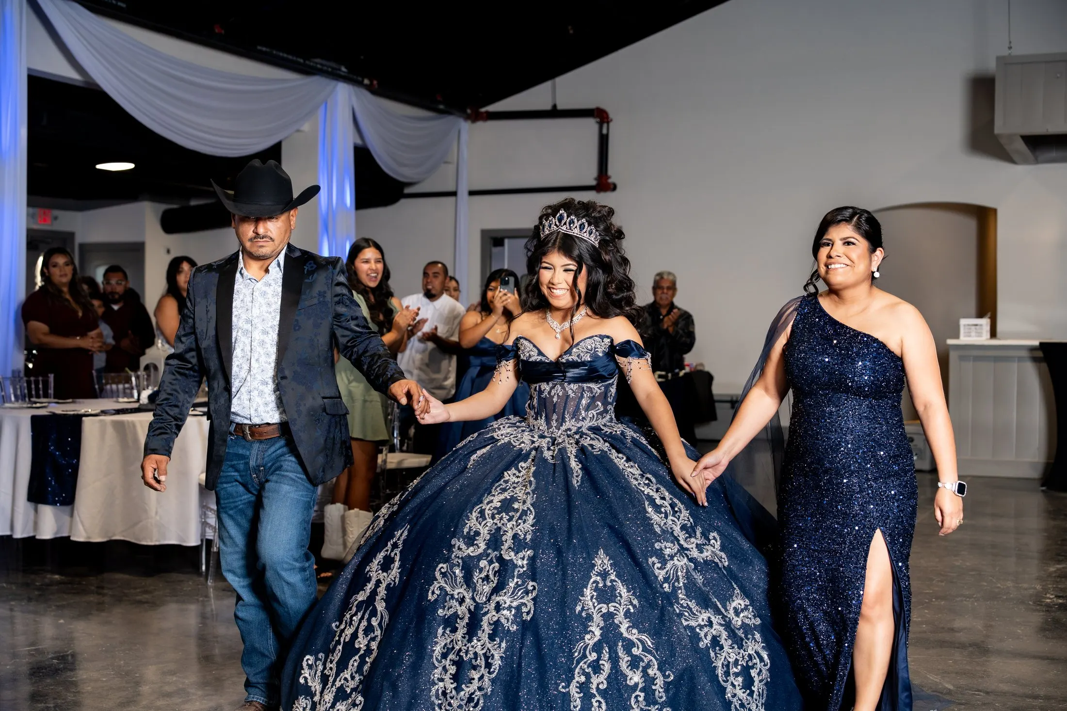 Julianna’s grand entrance, hand in hand with her family