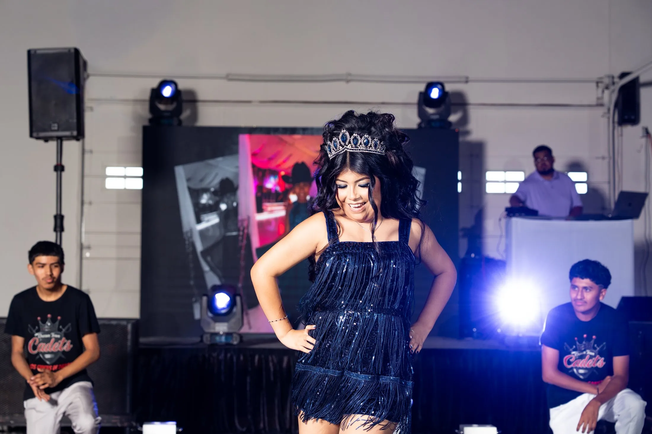 Quinceañera in a navy fringe dress for her surprise dance
