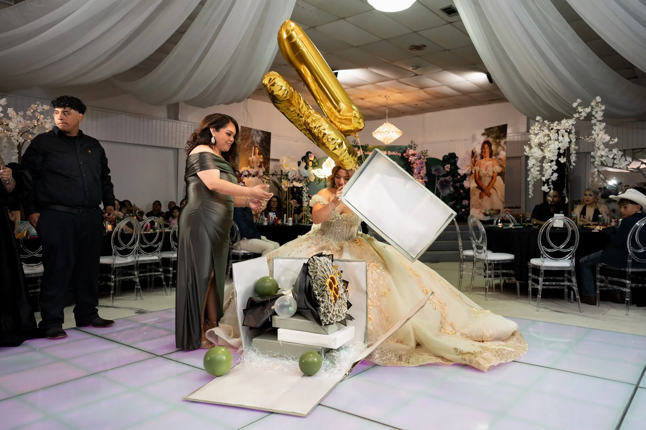 Gold number balloon rising from a surprise gift box