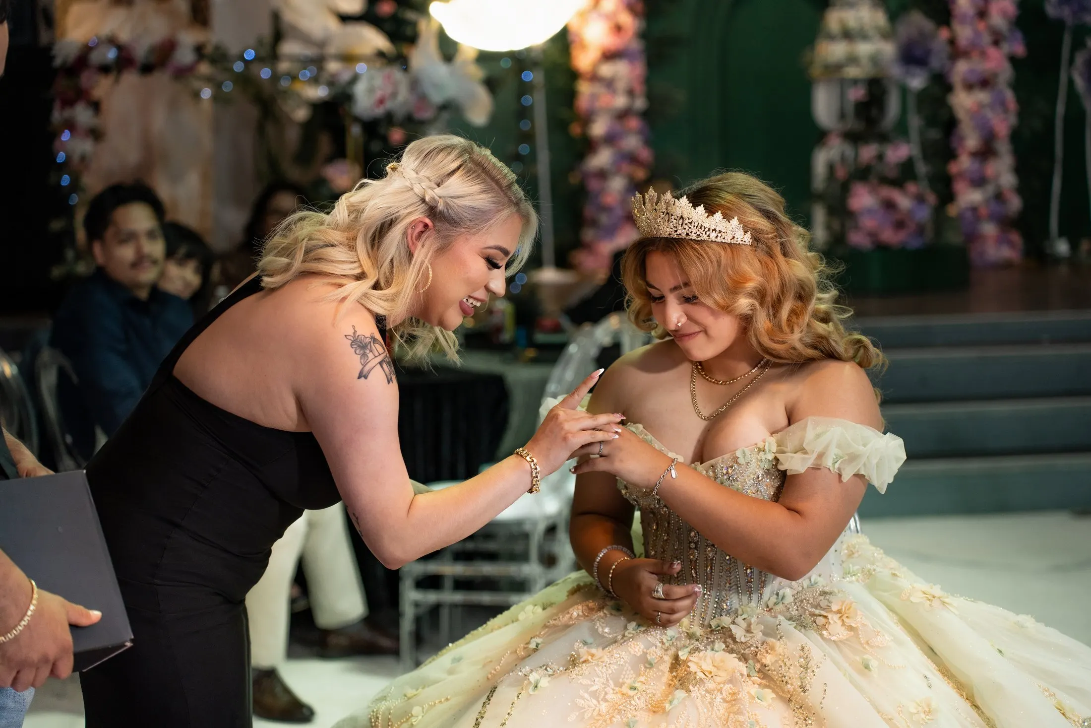 Family placing a ring on her finger during the traditions