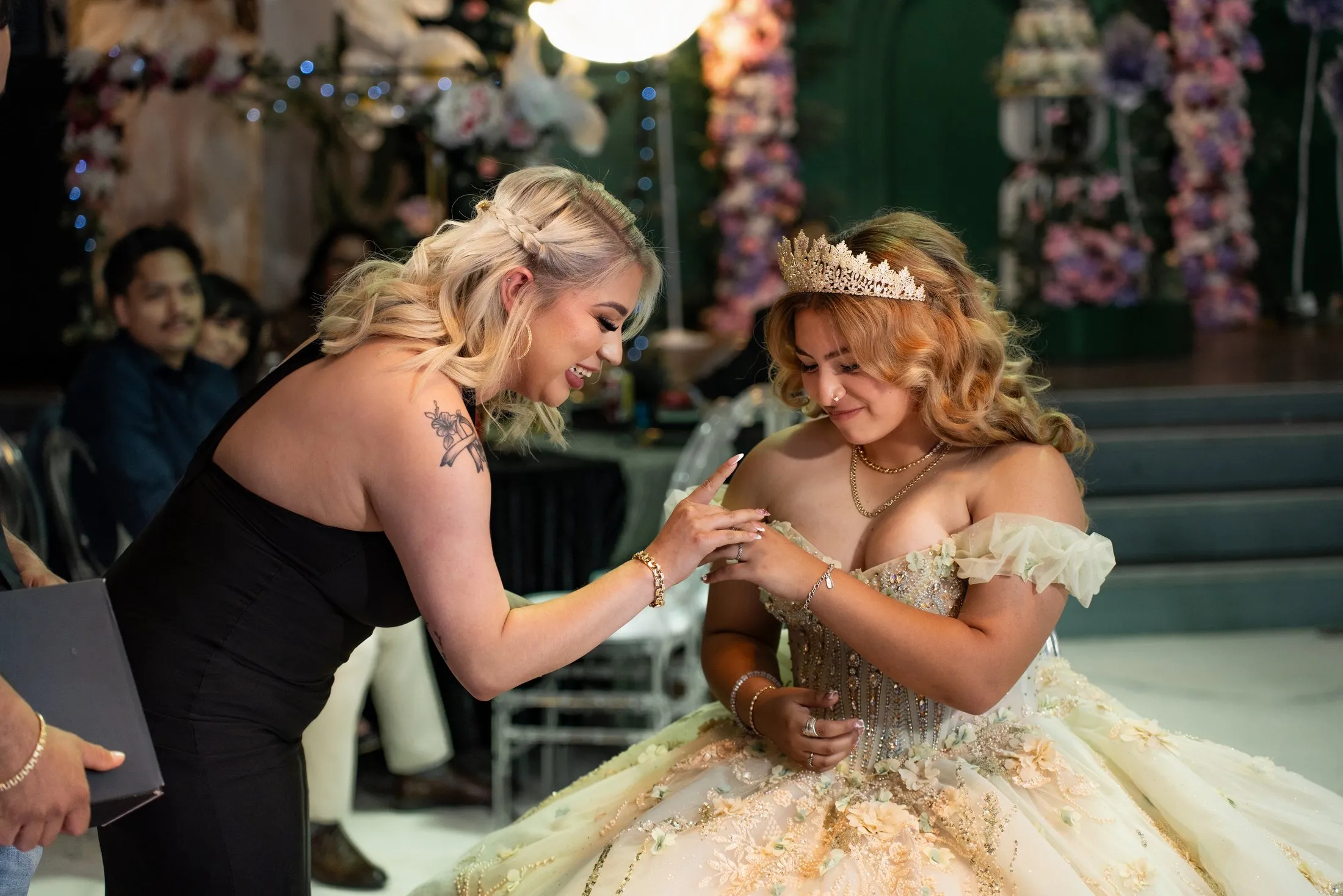 Family placing a ring on her finger during the traditions